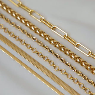 18k Gold plated brass Paperclip Chain  laid flat along with multiple other styled chains