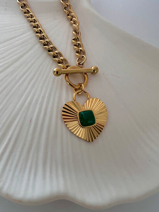 Green agate heart necklace in 18k gold plated on chunky curb link chain displayed on a white jewellery dish