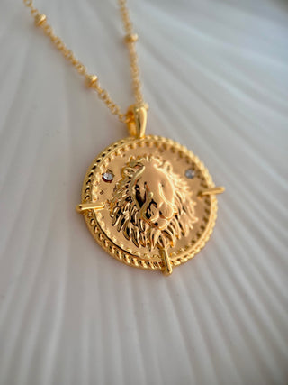 18k gold plated brass Leo Zodiac star sign Necklace with cubic zirconia stones and intricate detailing on a coin disc pendant and on fine ball chain.