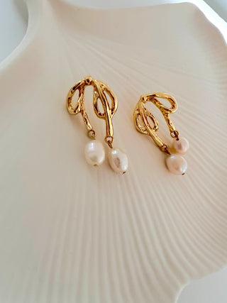 Pretty Bow earring with two freshwater pearl drops on each earring in 18k gold plating display on a white jewellery dish.