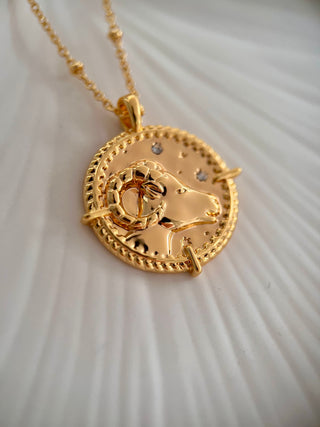 18k gold plated brass Aries star sign  Zodiac Necklace with cubic zirconia stones and intricate detailing on a coin disc pendant and on fine ball chain