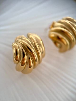 18k gold plated Chunky Curve Round Studs displayed on a white jewellery dish