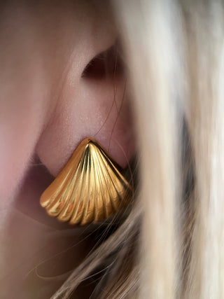 18k gold plated Curved Fan Studs earrings worn on a model with blond hair - Gold Lunar