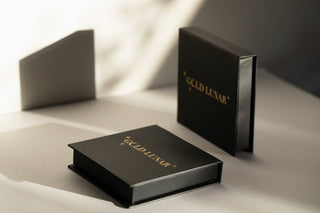 gold lunar gift boxes in black with gold font