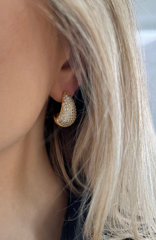 18k gold plated Large Teardrop shape earrings embellished with Cubic Zirconia stones worn on a model with blond hair - Gold Lunar