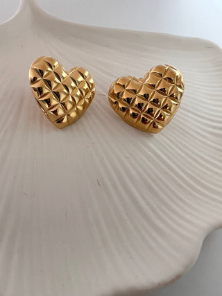 18k gold plated heart quilted chunky oversized large earrings on white jewellery dish