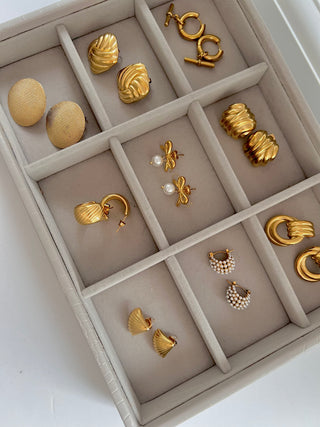 Stackers jewellery box with gold plated earrings from Gold Lunar in each compartment 