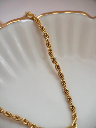 Close up of the rope twist chain necklace in 18k gold plated.